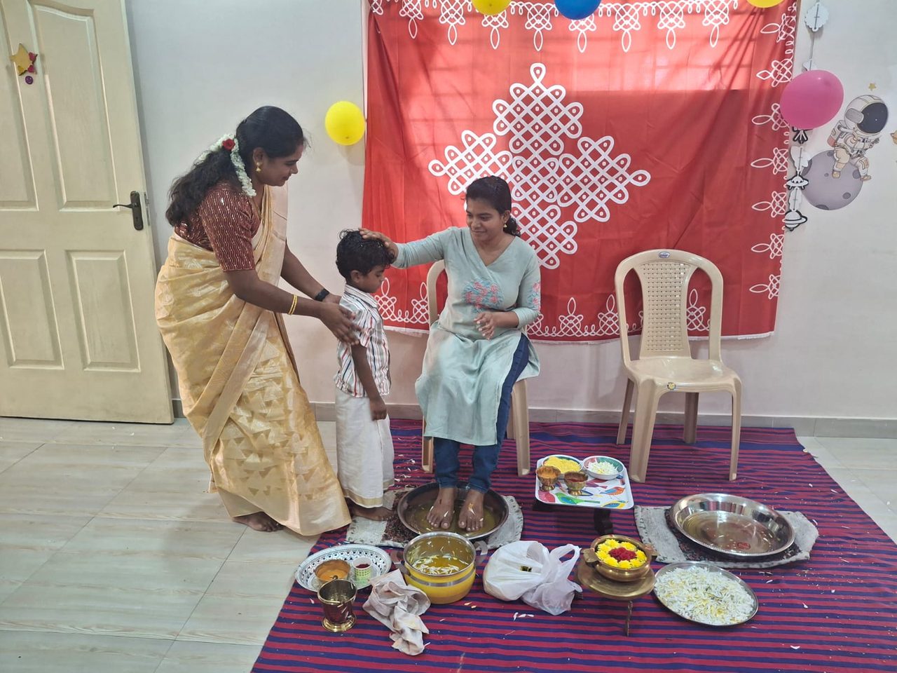 A teacher and a child during a traditional ceremony at the school